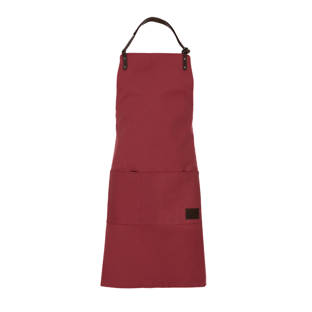 K0015XB | Canvas/Genuine Full-Grain Leather Work Apron. Bordeaux/Dark Brown. Antique Nickel Hardware. Dimensions: 70 x 90 x 0.5 cm. Packaging: Polybag