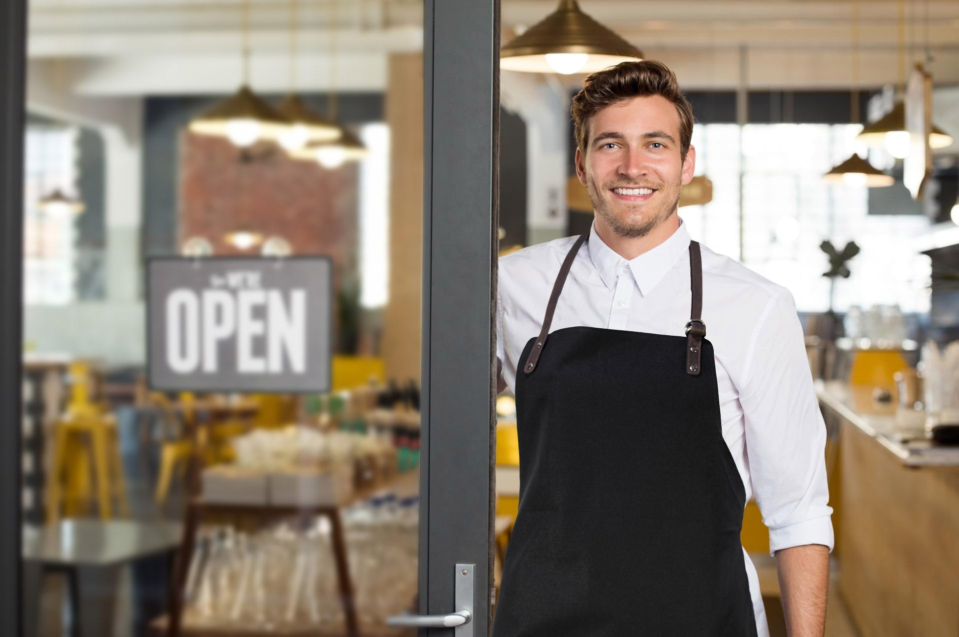 K0015XB | Canvas/Genuine Full-Grain Leather Work Apron. Bordeaux/Dark Brown. Antique Nickel Hardware. Dimensions: 70 x 90 x 0.5 cm. Packaging: Polybag